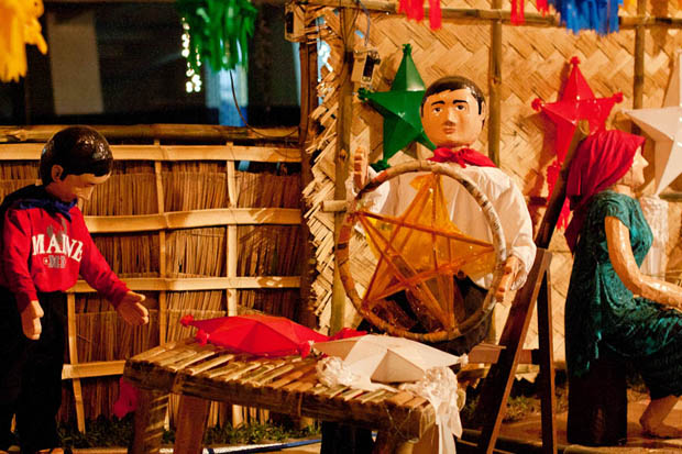 A Filipino Christmas. A diorama depicting the Filipino tradition of lantern making is displayed outside the Blue Eagle Gym. Photo by Mario T. Dagdag